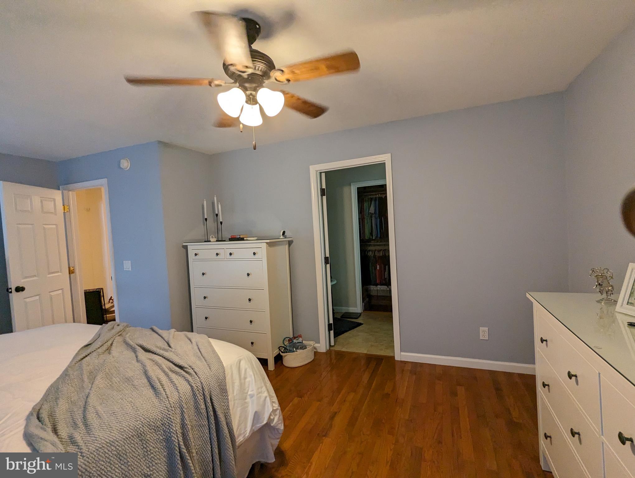 25 Maple Avenue Gettysburg, PA 17325 - Photo 33 of 35 a bedroom with a bed and a chandelier