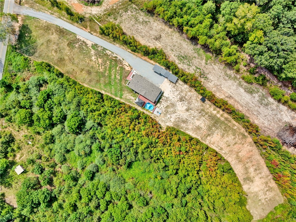 2655 State Rd S-4-108 Anderson, SC 29624 - Photo 29 of 37 An aerial perspective reveals the home nestled within private wooded acreage.