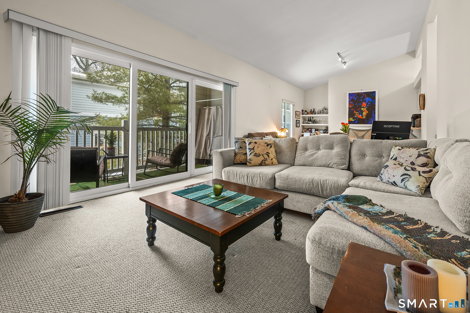 19 Cook Close, Unit 19 Ridgefield, CT 06877 - Photo 15 of 32 The living room has lots of space, soaring ceilings and light from the sliders.