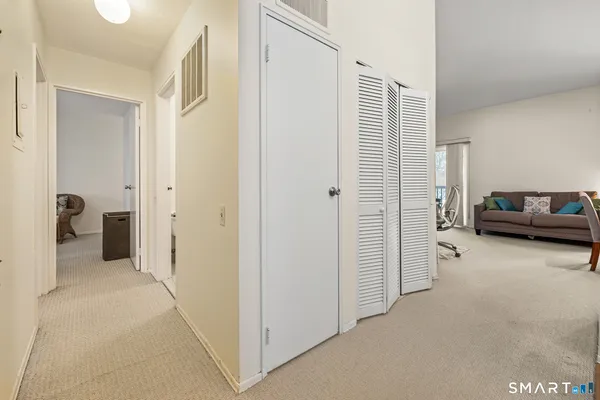 a view of hallway with walk in closet