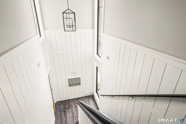 a view of front door with wooden floor
