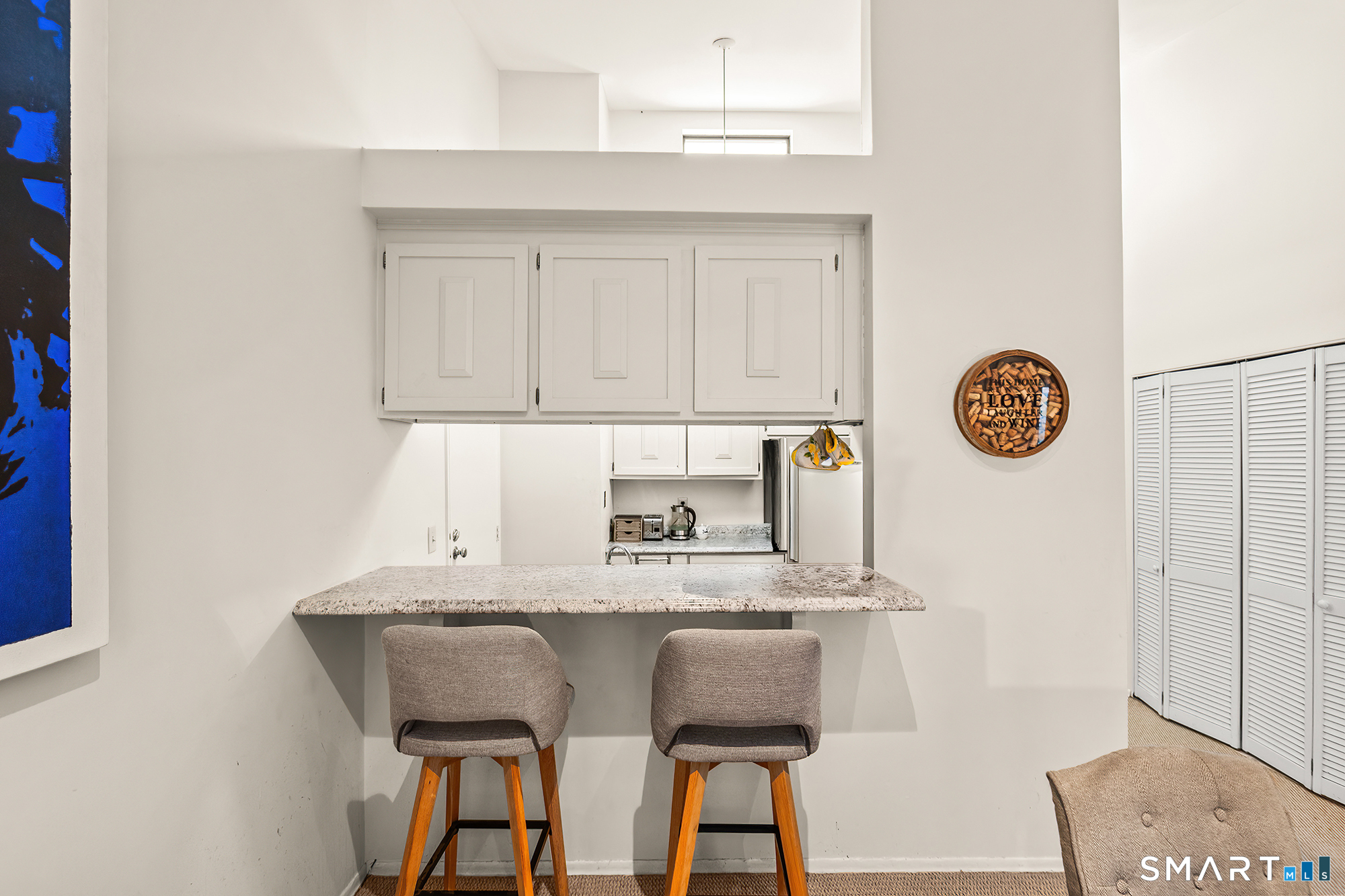 19 Cook Close, Unit 19 Ridgefield, CT 06877 - Photo 9 of 32 The breakfast bar adds a nice extra eating space.