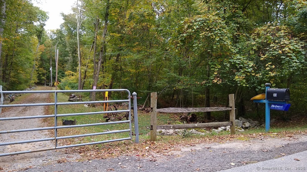 0 Chowanec Road Columbia, CT 06237 - Photo 9 of 12 a view of a wooden fence and trees