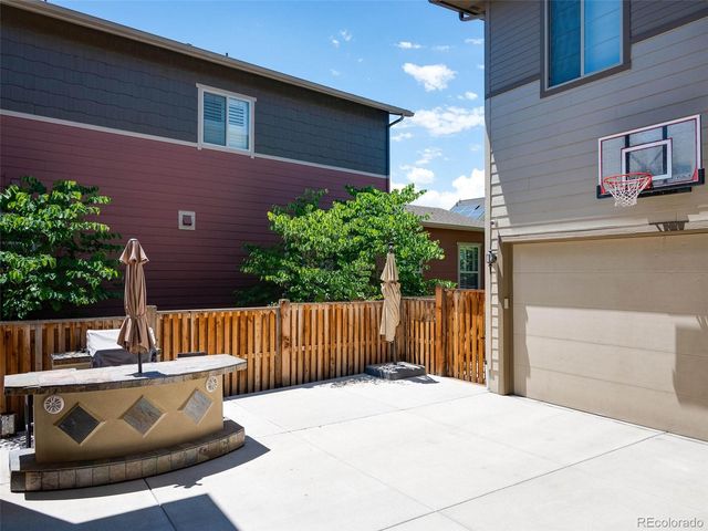 a wooden bench sitting in front of a building