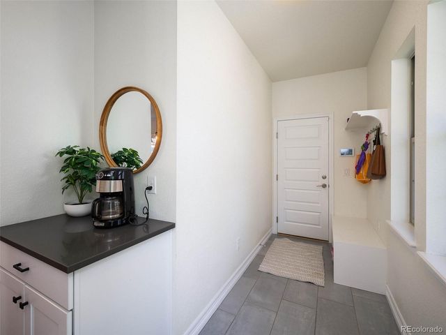 a view of a hallway with a potted plant