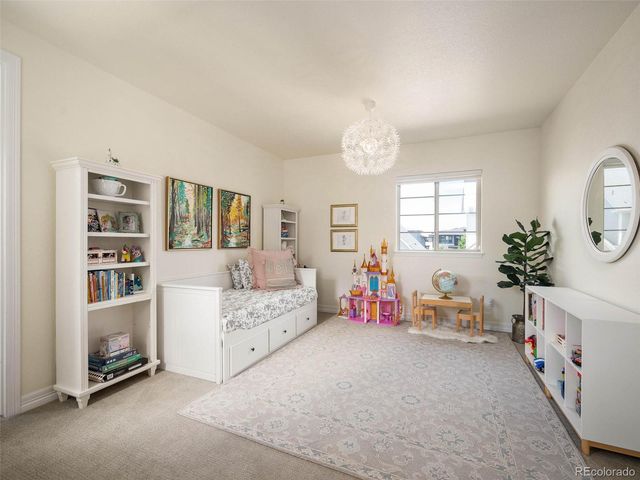 a bed room with furniture and a window
