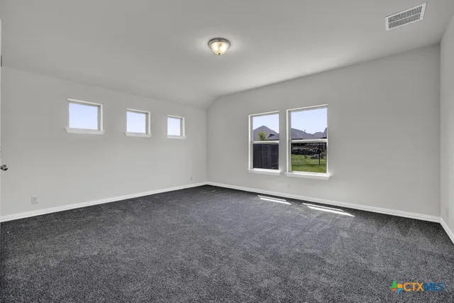 an empty room with windows