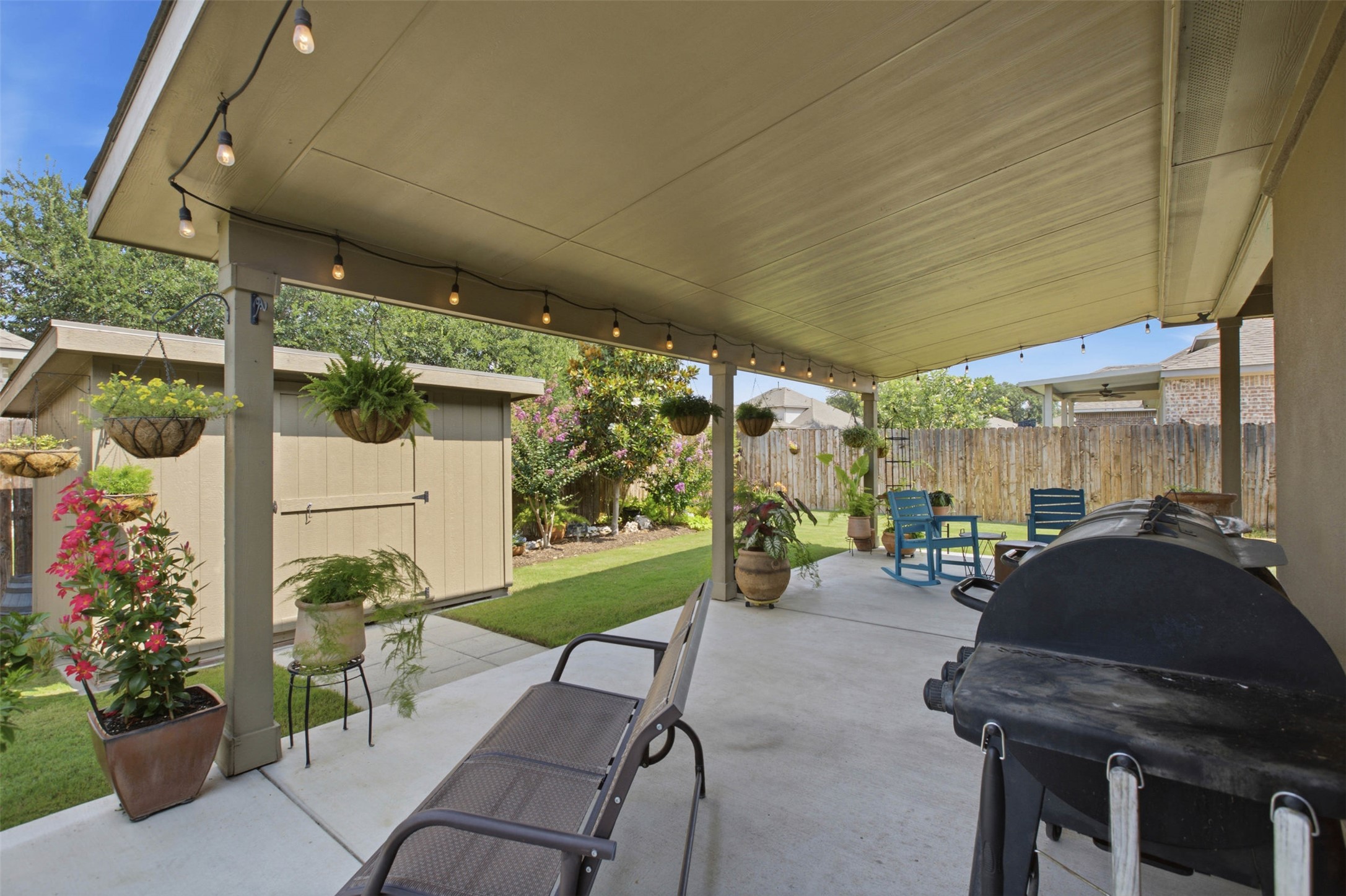2413 Bridges Ranch Road Georgetown, TX 78628 - Photo 24 of 31 A spacious covered patio provides a delightful outdoor living area, perfect for relaxation and entertaining.