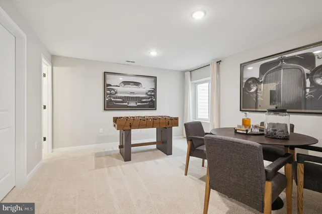 a dining room with furniture and window