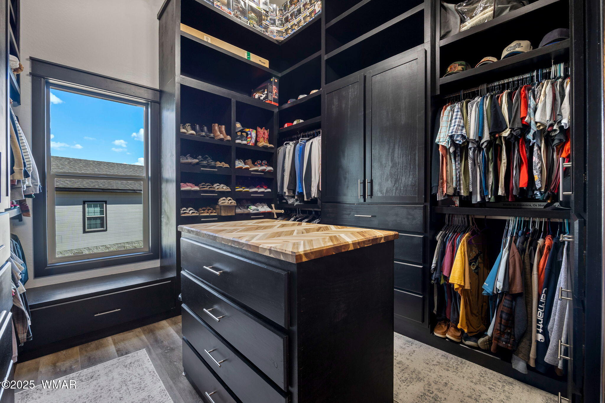7106 Long Road Show Low, AZ 85901 - Photo 22 of 65 a view of walk in closet with clothes and shoes