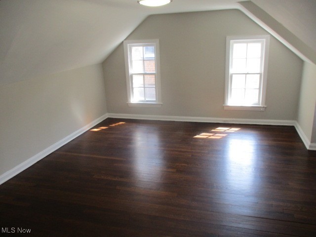 3703 Bainbridge Road Cleveland Heights, OH 44118 - Photo 10 of 16 Additional living space featuring dark wood-style floors and vaulted ceiling