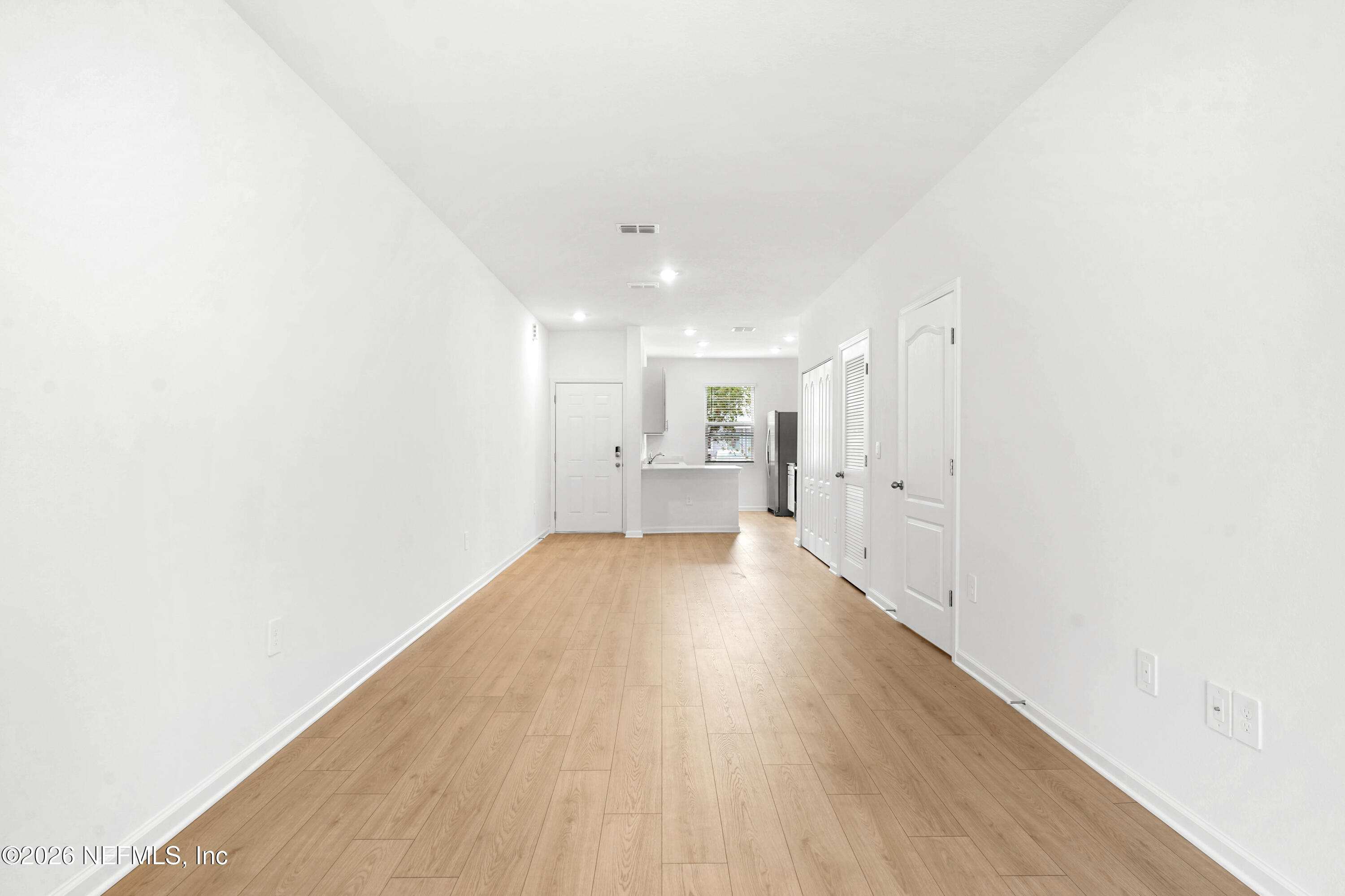 135 Palmetto Rdg Road St. Augustine, FL 32095 - Photo 12 of 27 a view of a big room with wooden floor and windows