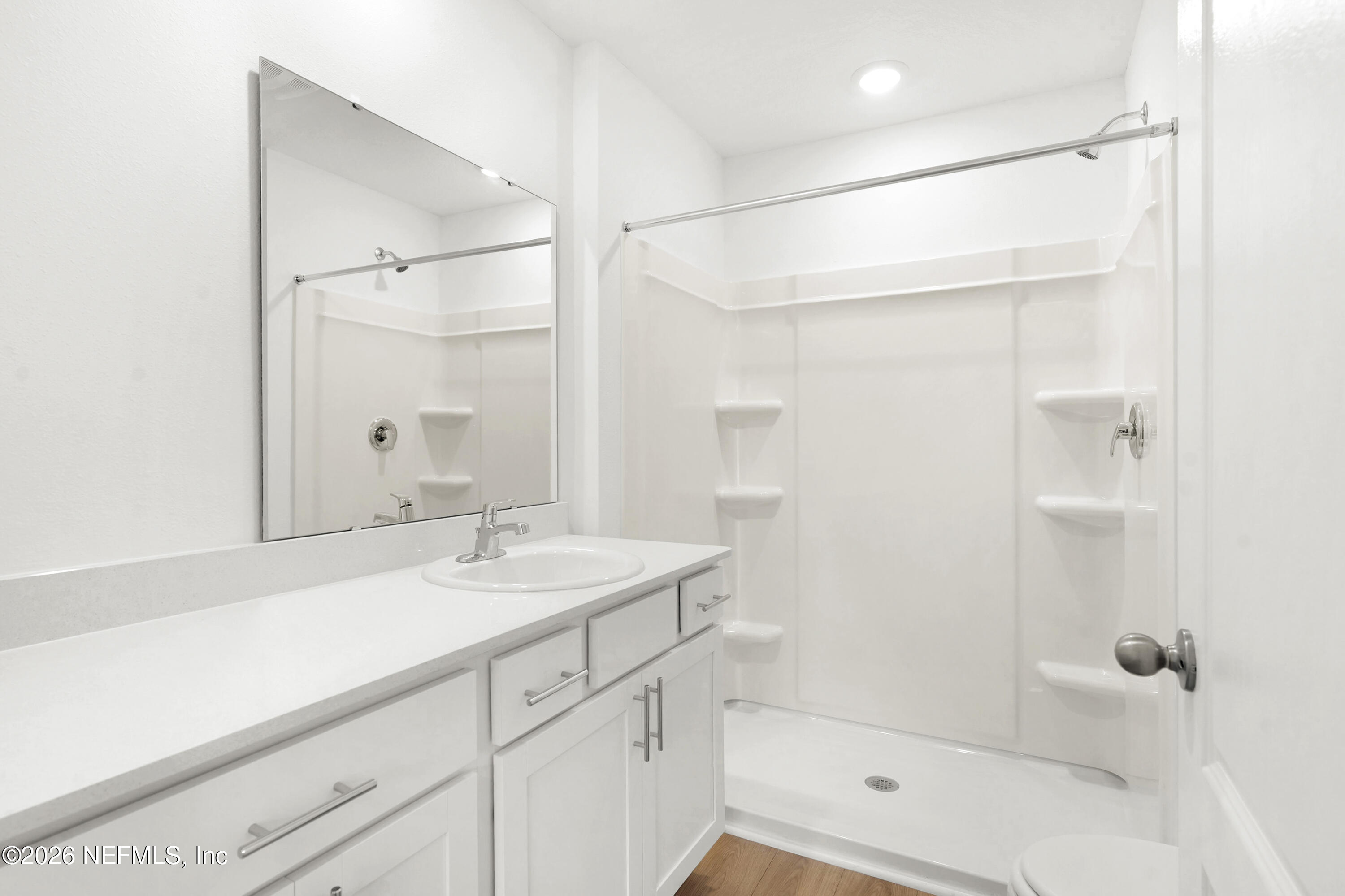 135 Palmetto Rdg Road St. Augustine, FL 32095 - Photo 19 of 27 a bathroom with a shower sink and mirror