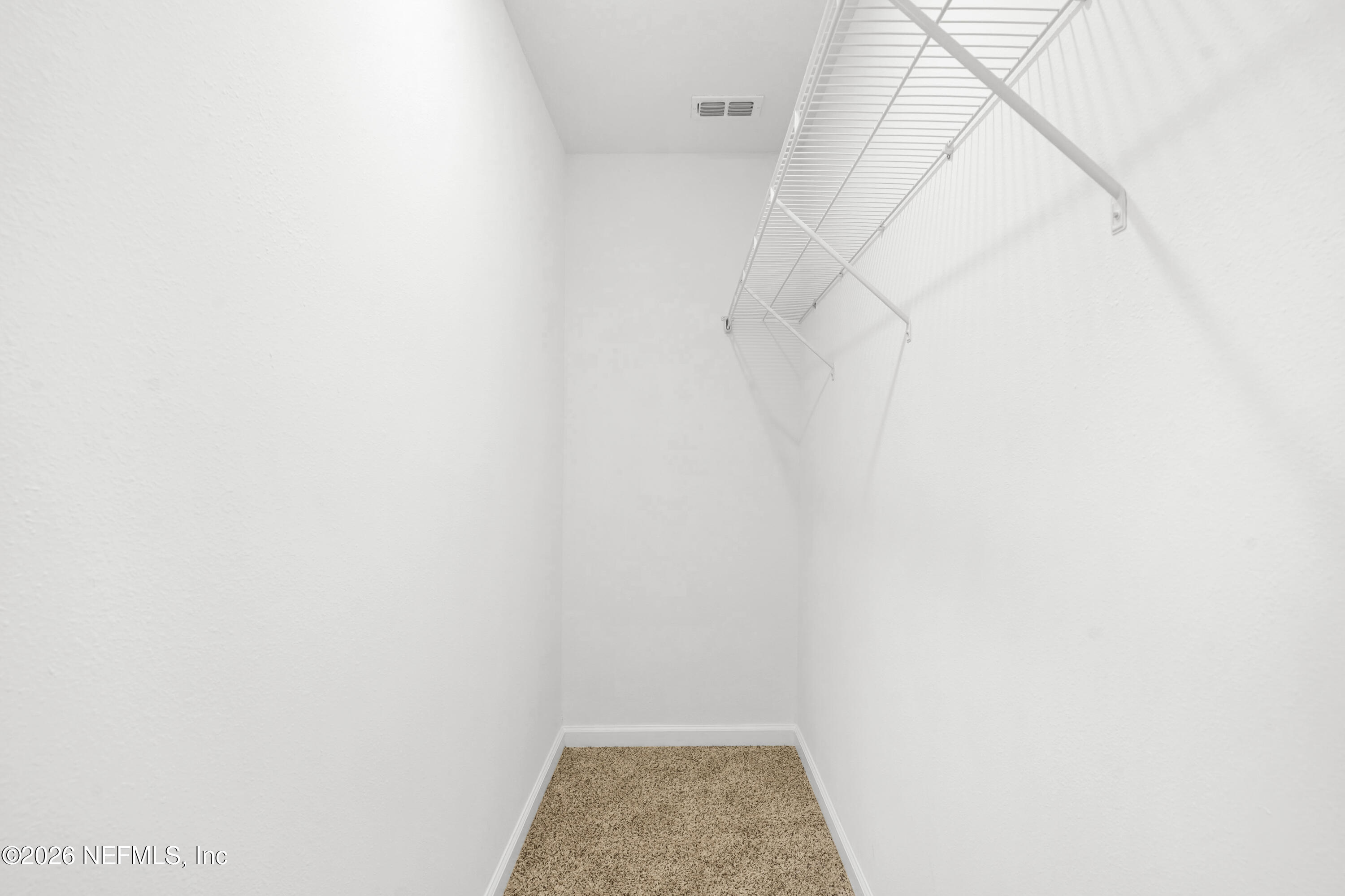 135 Palmetto Rdg Road St. Augustine, FL 32095 - Photo 20 of 27 a view of walk in closet with racks
