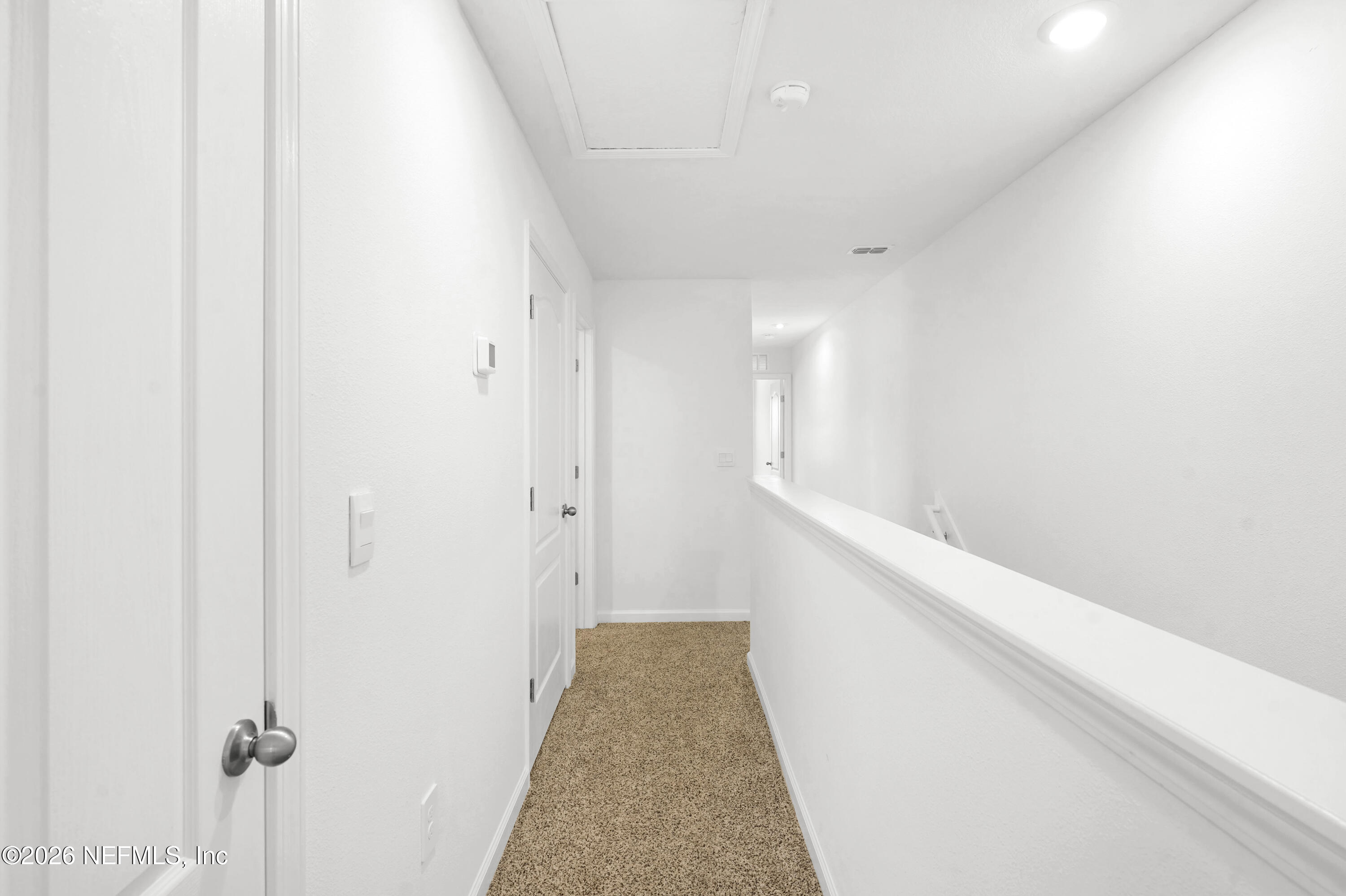 135 Palmetto Rdg Road St. Augustine, FL 32095 - Photo 21 of 27 a view of a hallway with white walls