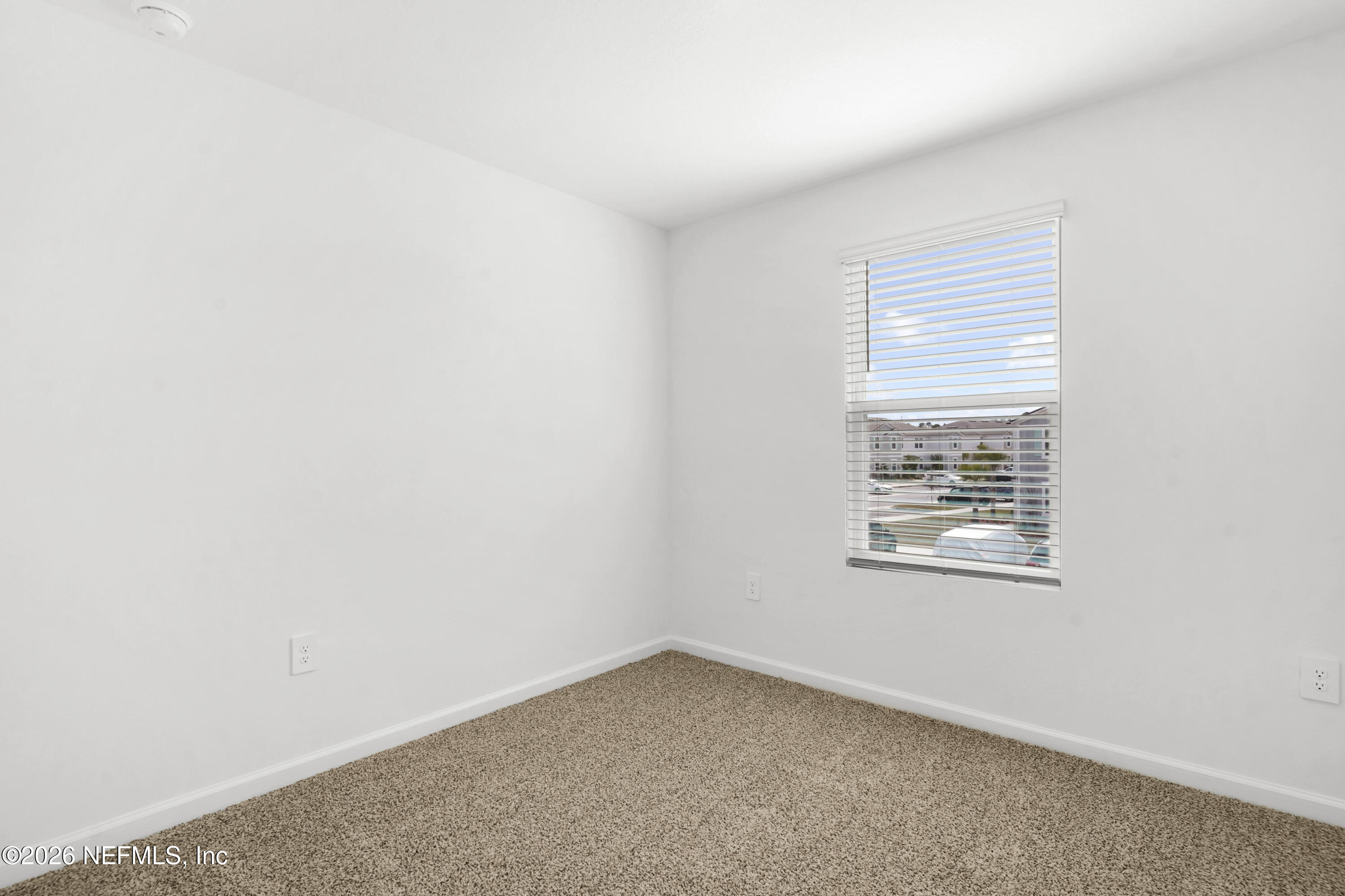 135 Palmetto Rdg Road St. Augustine, FL 32095 - Photo 24 of 27 an empty room with a window
