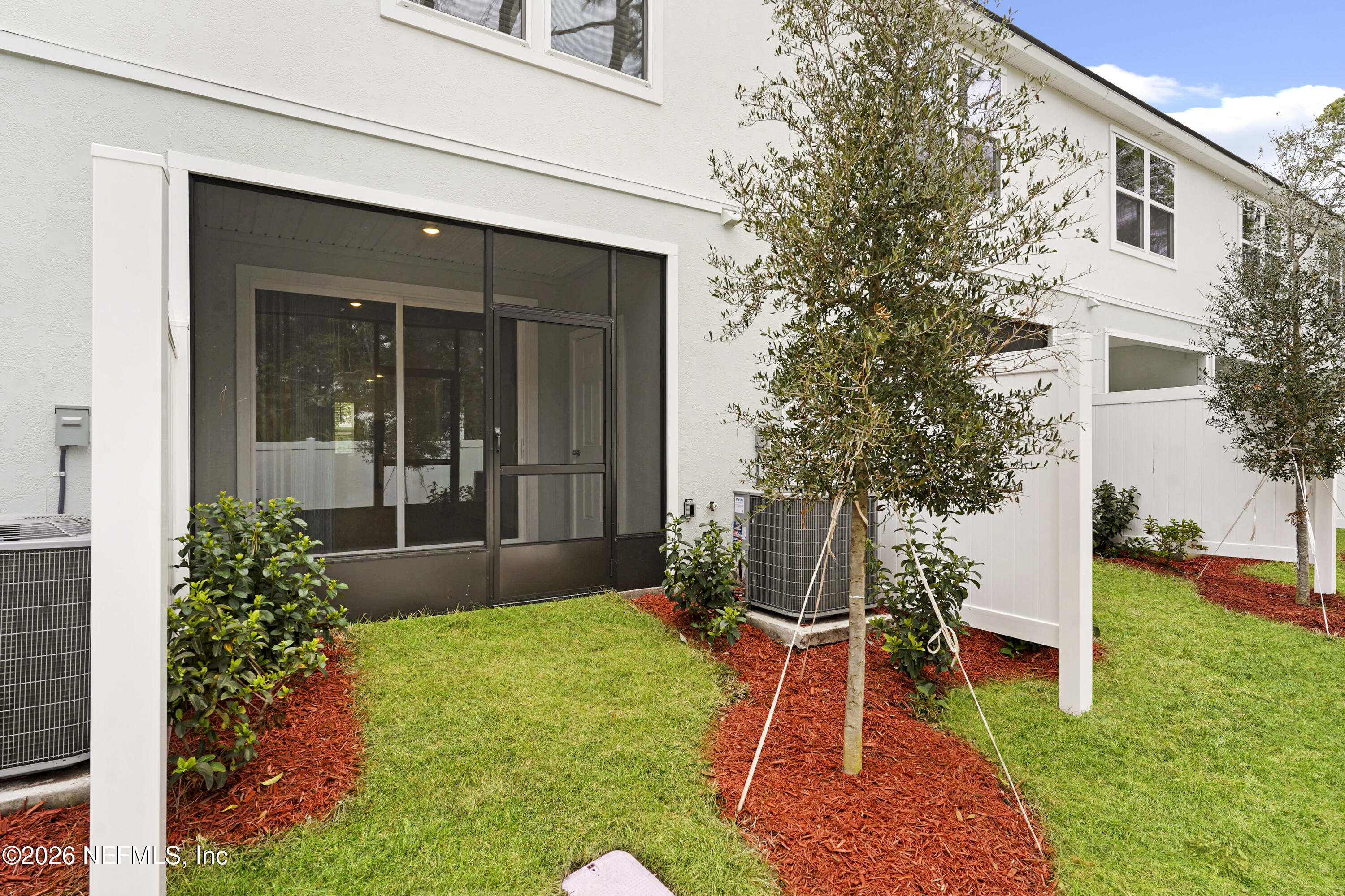 135 Palmetto Rdg Road St. Augustine, FL 32095 - Photo 27 of 27 a front view of a house with a yard
