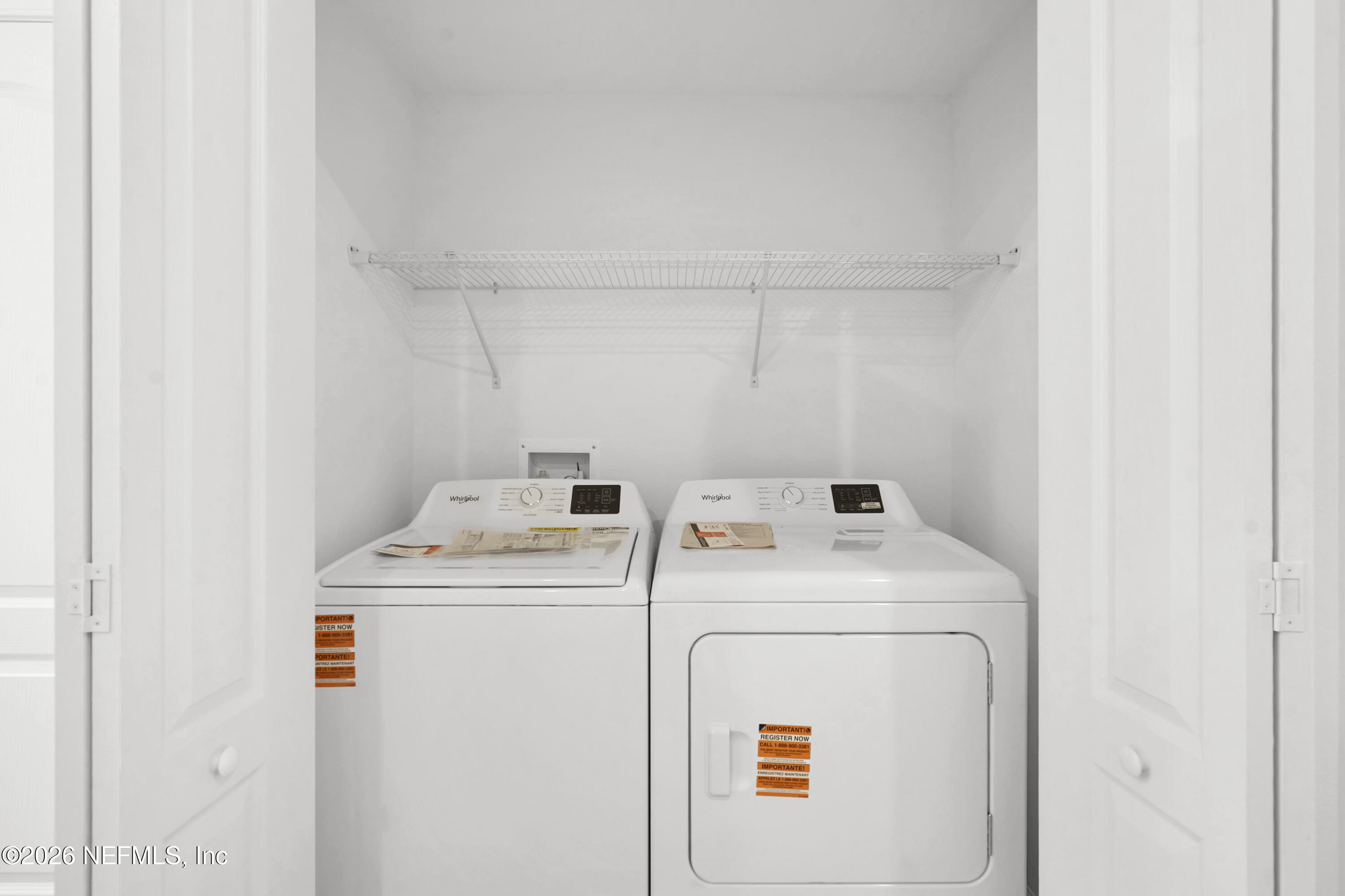 135 Palmetto Rdg Road St. Augustine, FL 32095 - Photo 9 of 27 a utility room with dryer and washer