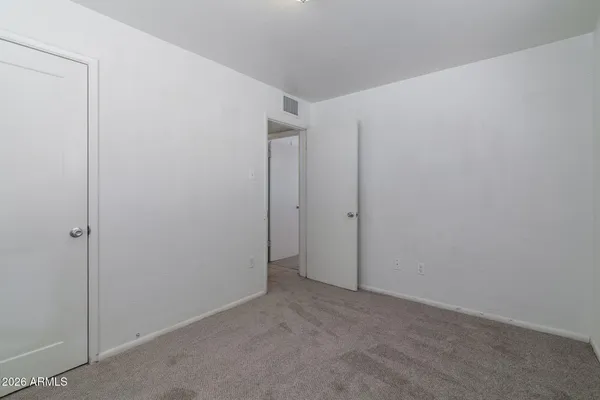 a view of empty room with windows