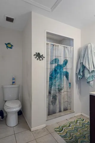 a bed room with a bed and a chandelier