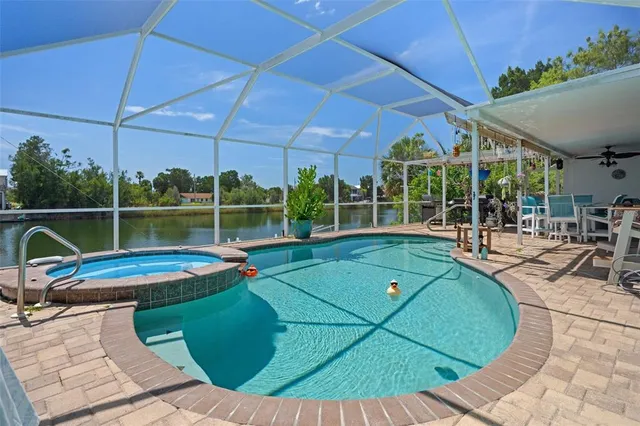 a view of a swimming pool with a patio