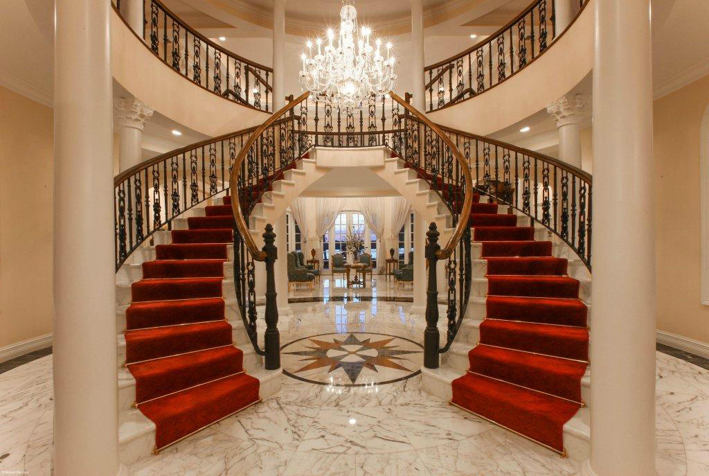 410 South Beach Road Hobe Sound, FL 33455 - Photo 9 of 36 Foyer entry with stair case - Copy