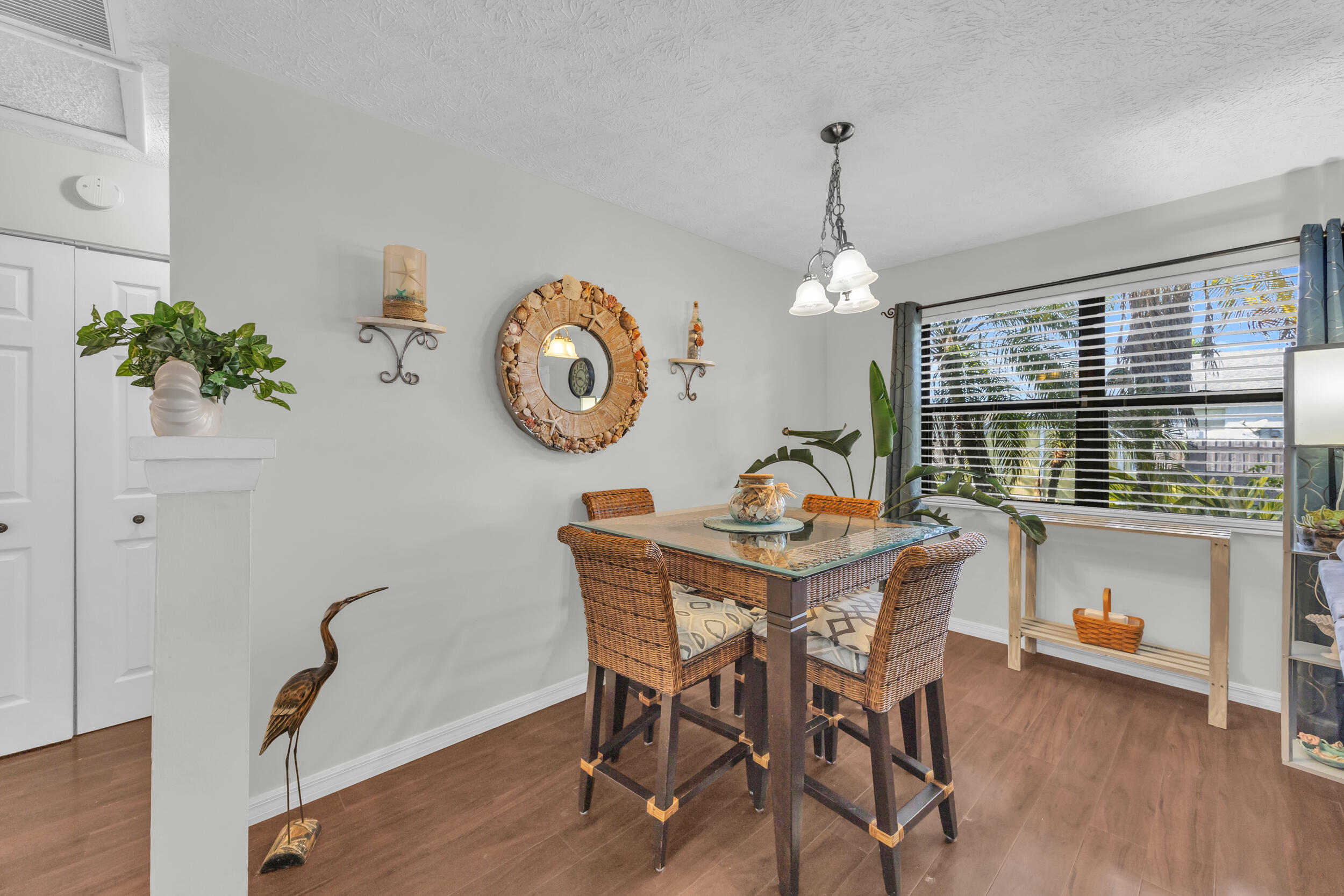261 Southwest Chelsea Terrace Port St. Lucie, FL 34984 - Photo 11 of 25 a dining room table chair and chandelier