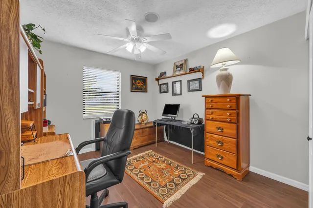 a workspace with furniture and chandelier