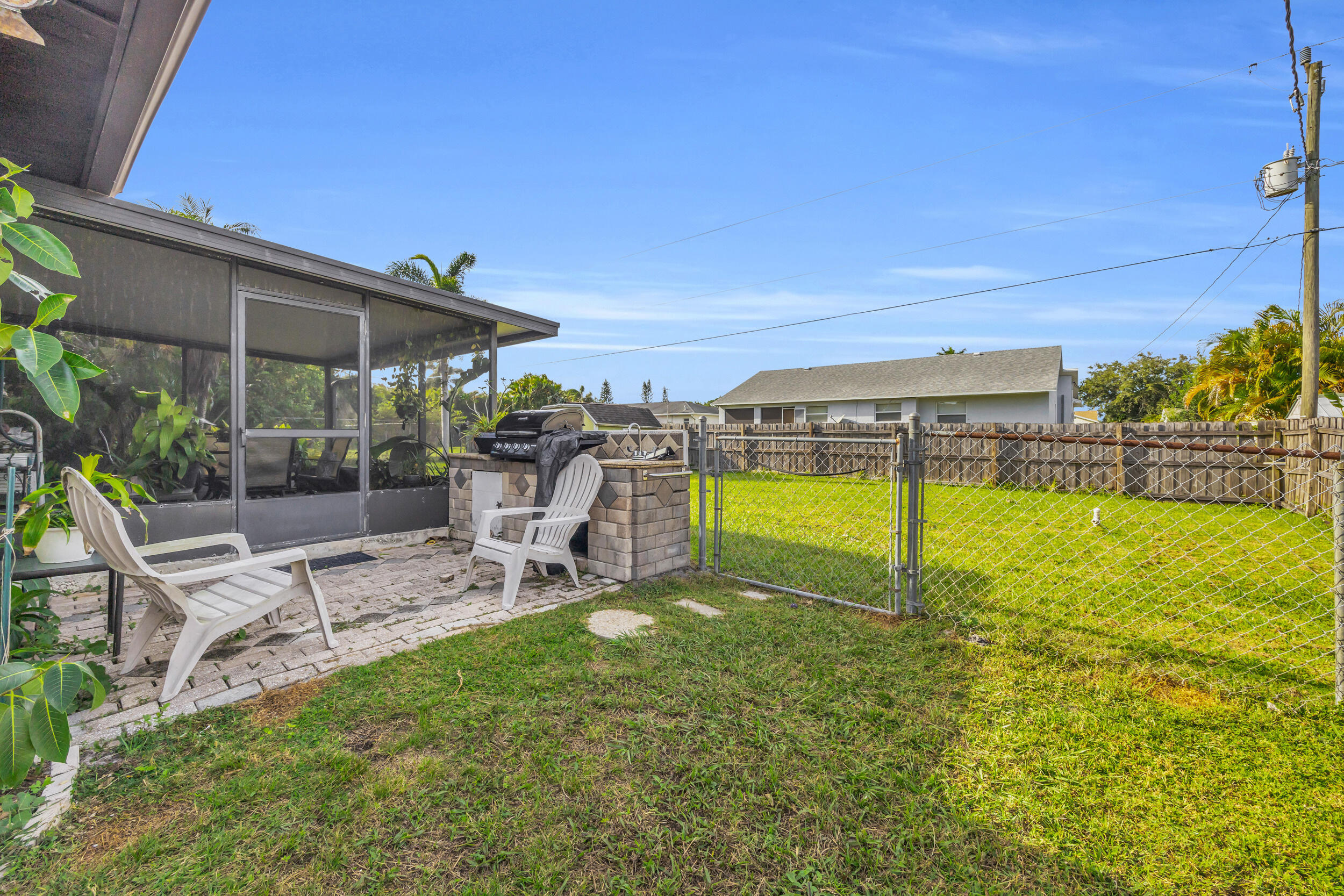 261 Southwest Chelsea Terrace Port St. Lucie, FL 34984 - Photo 22 of 25 a view of a swimming pool with a patio