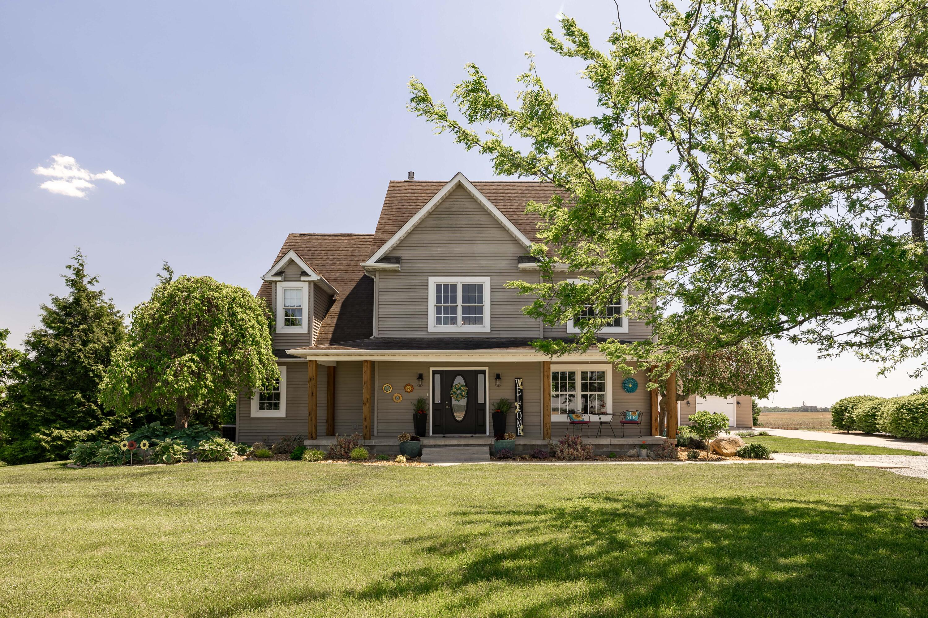 1601 East Amsler Road Rensselaer, IN 47978 - Photo 1 of 70 a front view of a house with a garden