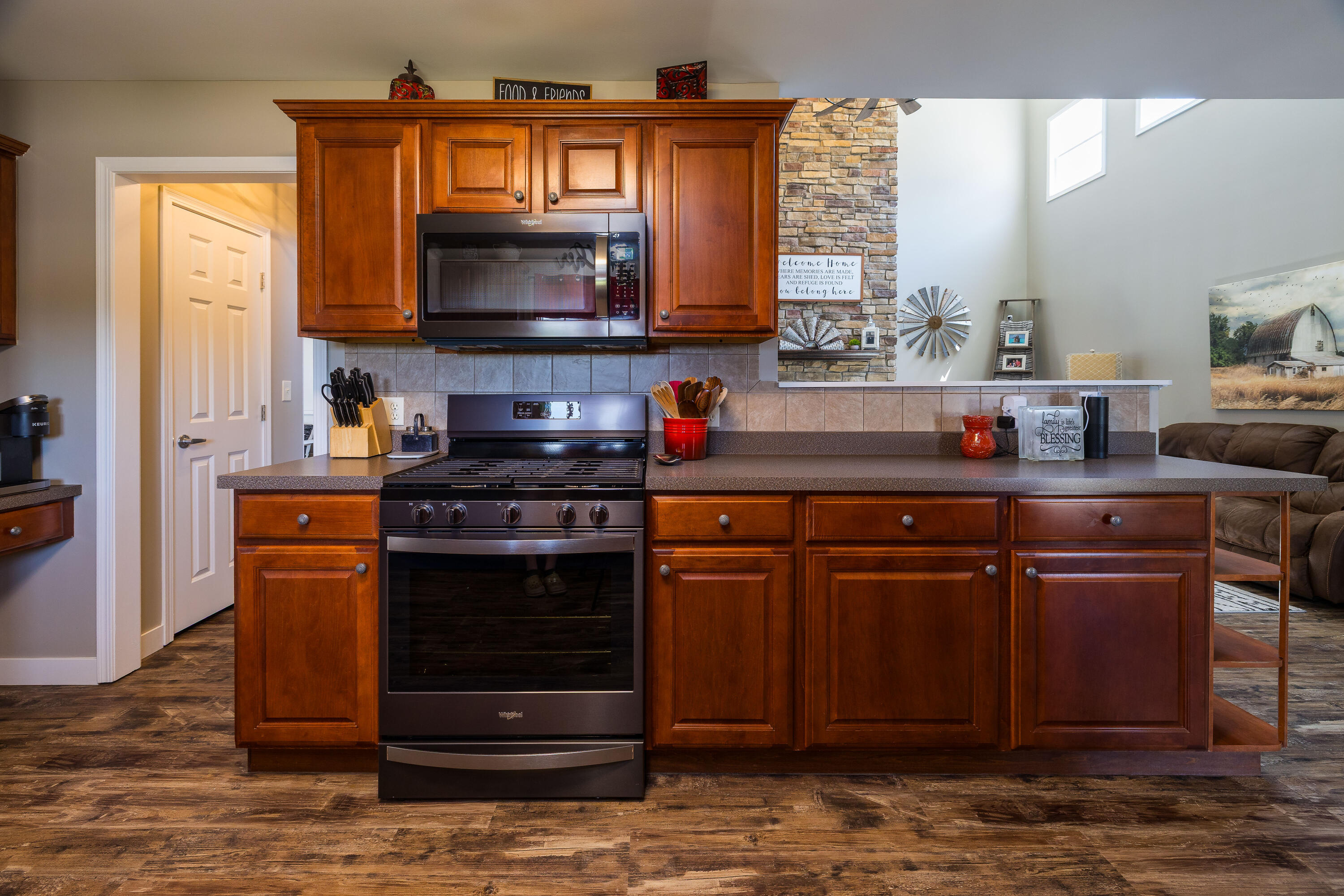 1601 East Amsler Road Rensselaer, IN 47978 - Photo 18 of 70 a kitchen with stainless steel appliances a stove a sink and a microwave