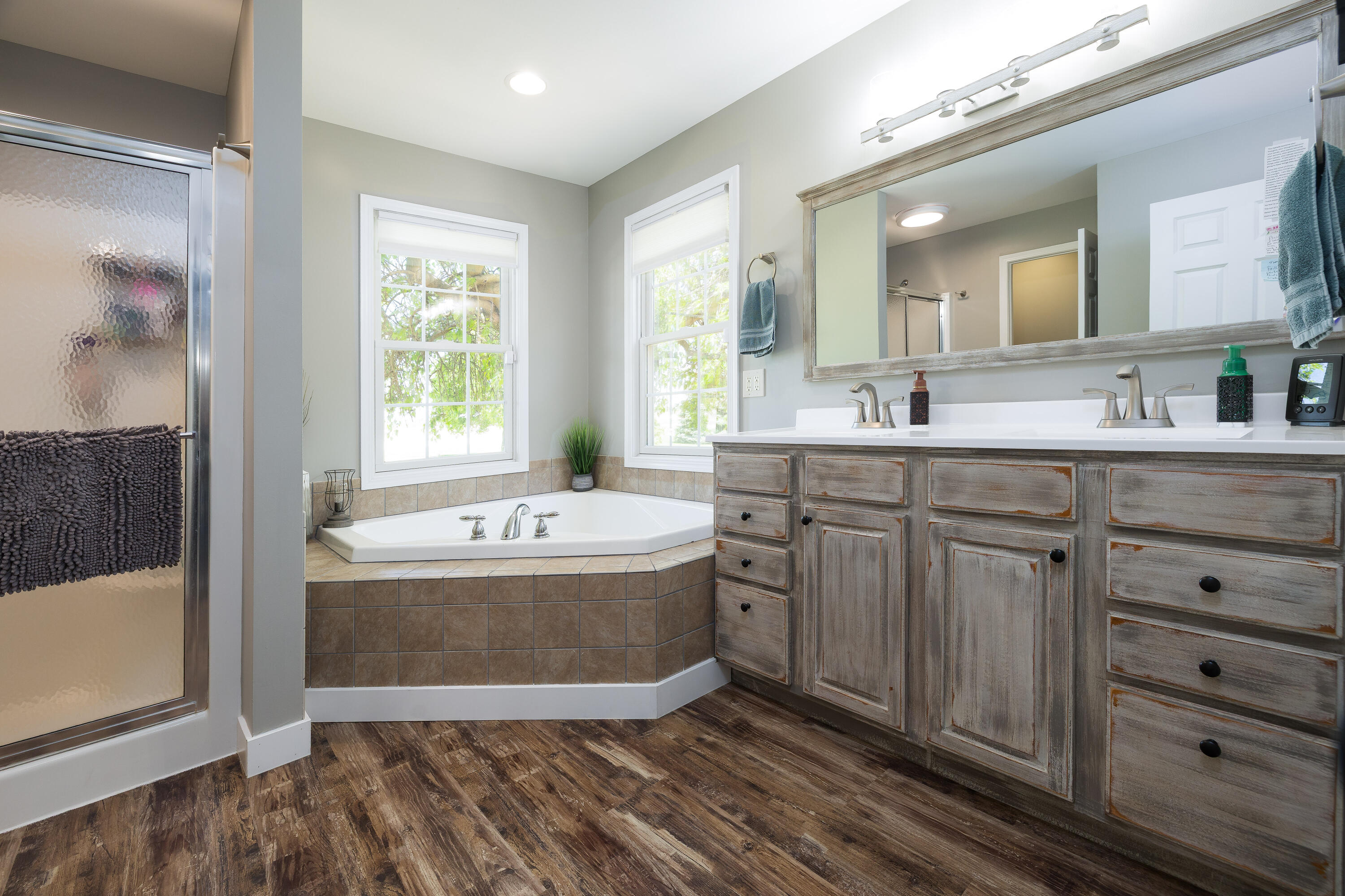 1601 East Amsler Road Rensselaer, IN 47978 - Photo 35 of 70 a spacious bathroom with a tub sink and mirror