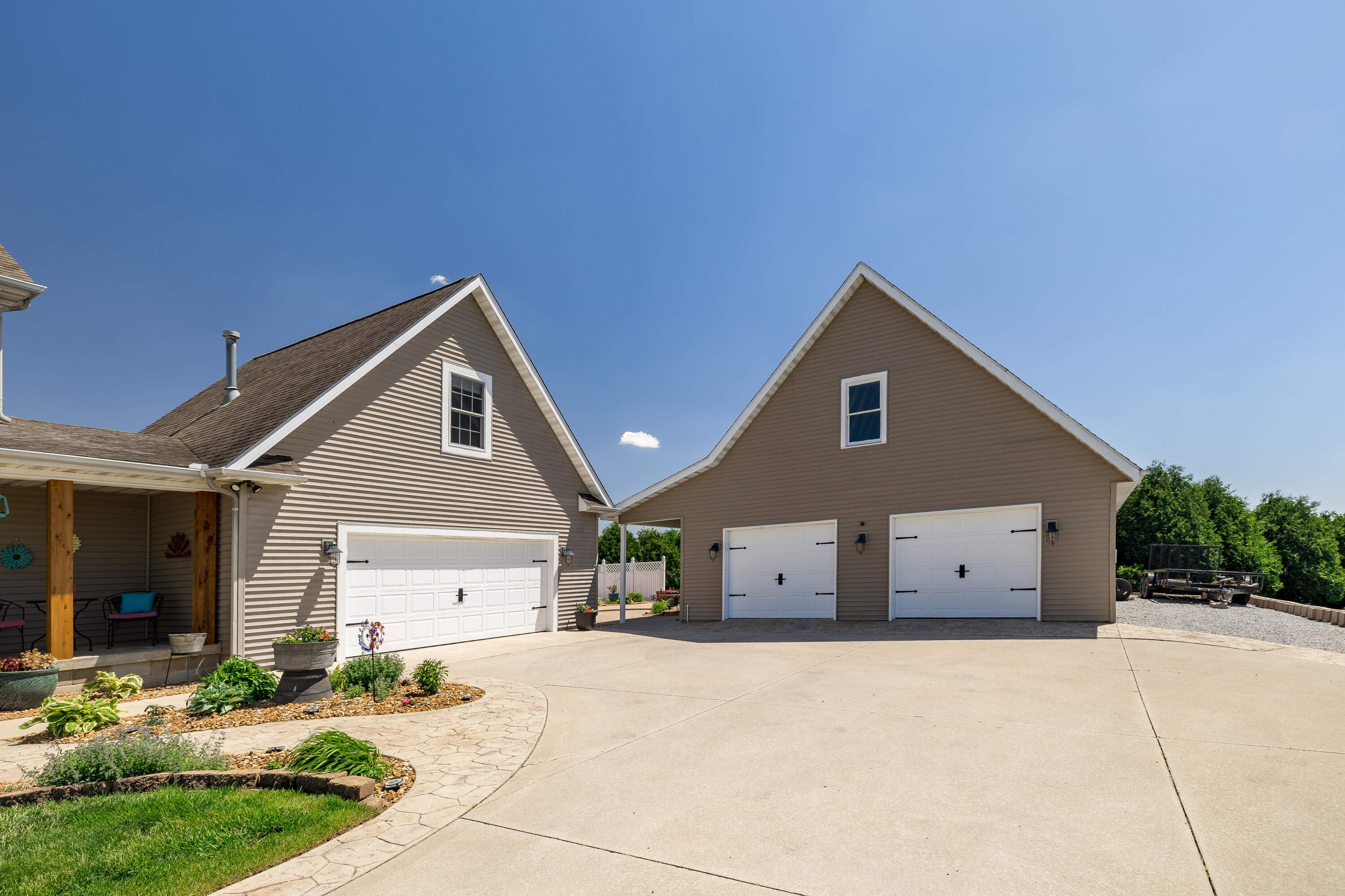 1601 East Amsler Road Rensselaer, IN 47978 - Photo 53 of 70 a front view of a house with a yard and garage