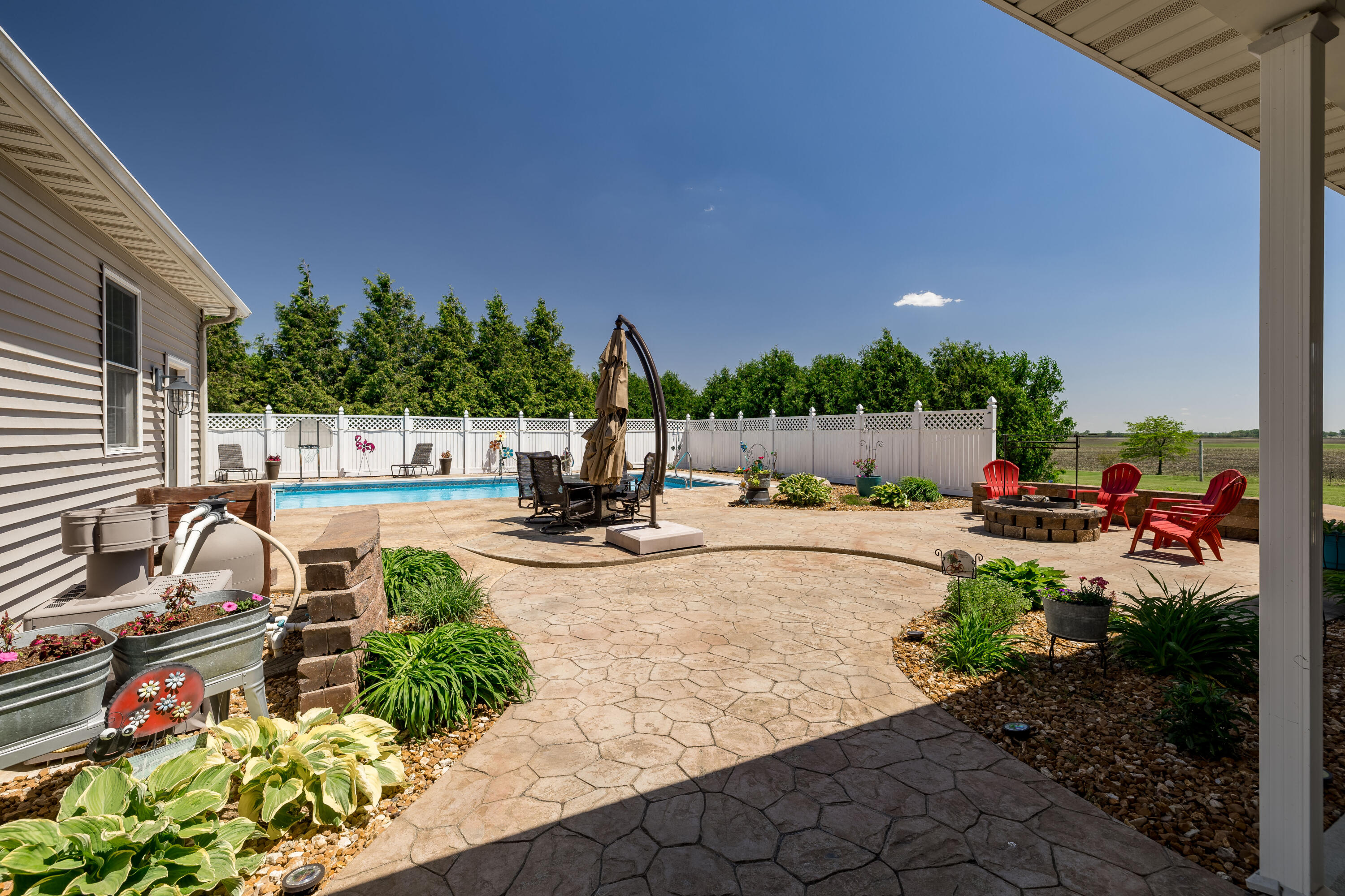 1601 East Amsler Road Rensselaer, IN 47978 - Photo 54 of 70 a view of yard with seating area and trees in the background