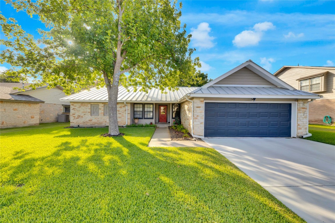 523 Pigeon Forge Road Pflugerville, TX 78660 - Photo 1 of 1 a front view of a house with a yard garage and outdoor seating