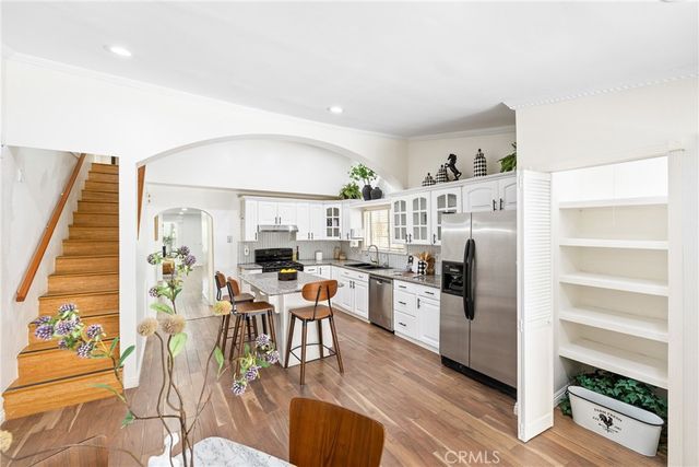 a bathroom with a window and a mirror