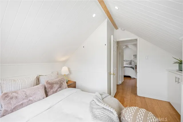 a kitchen with a sink cabinets stainless steel appliances and a window