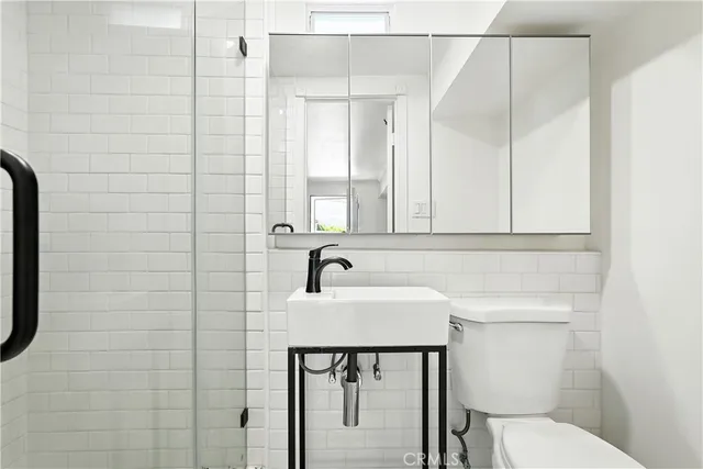 a view of balcony with wooden floor and outdoor seating