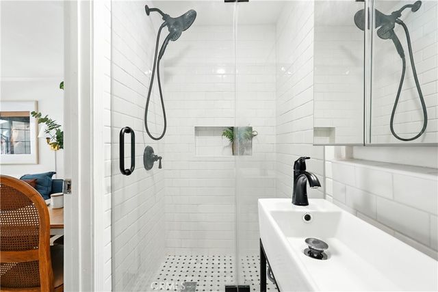 a view of a patio with table and chairs and potted plants