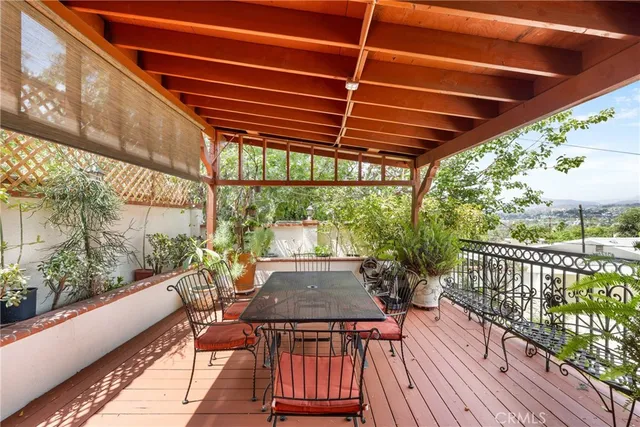 an aerial view of residential houses with outdoor space and mountain view