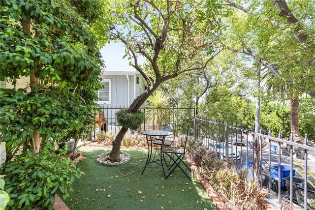 a living room with furniture or couch and a wooden floor