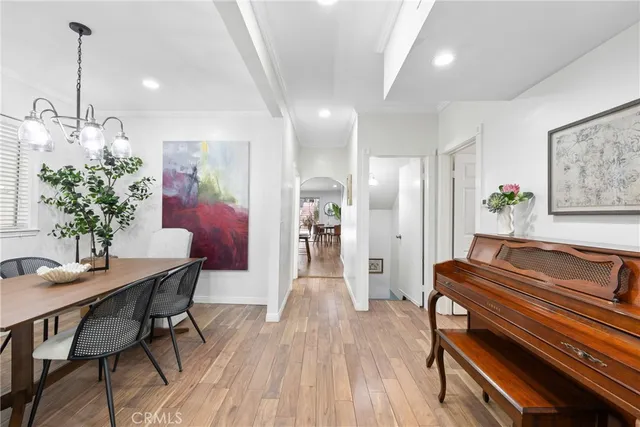 a kitchen with stainless steel appliances kitchen island granite countertop a kitchen island a stove a table and chairs