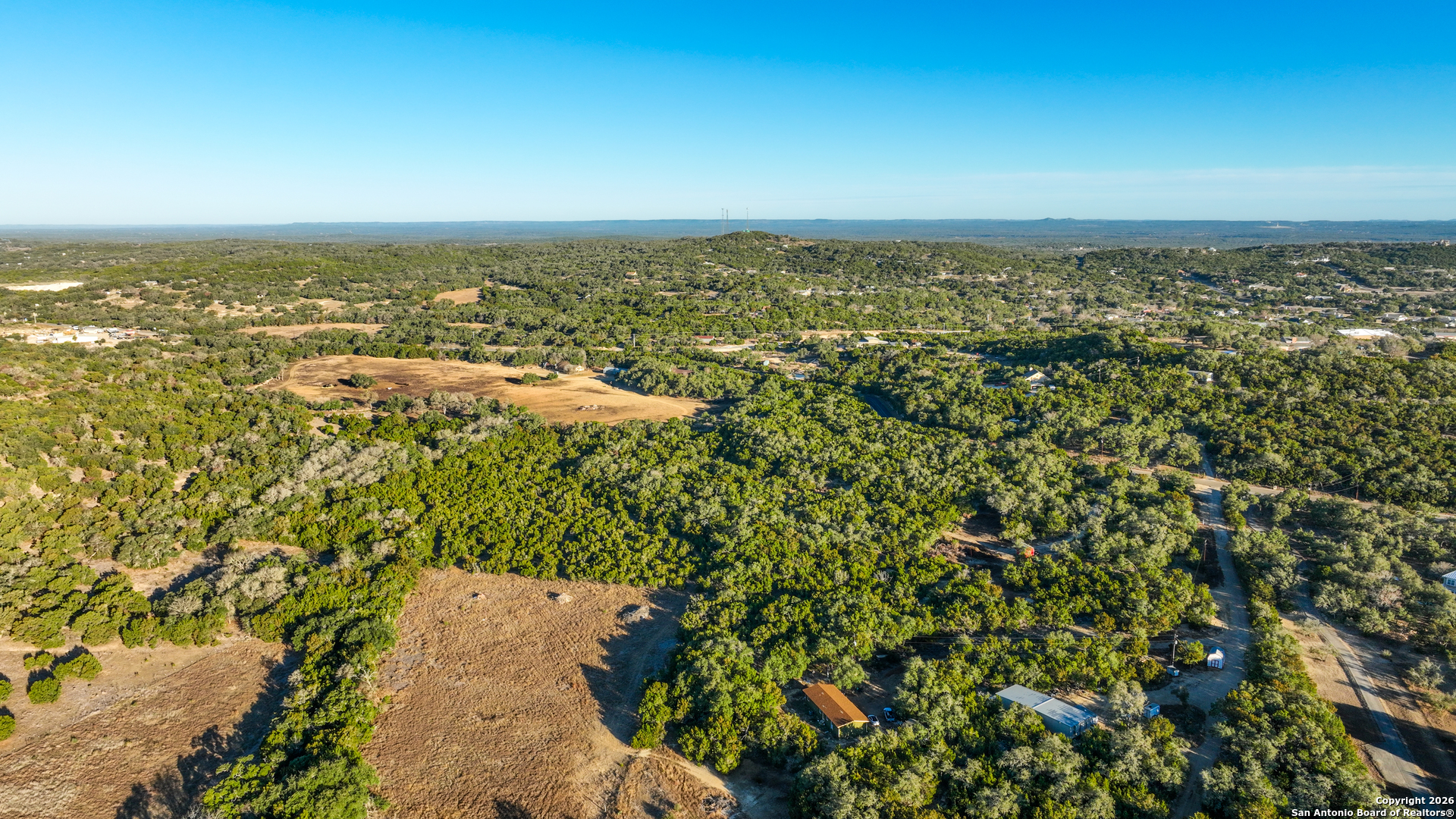 1515 Old Boerne Road Bulverde, TX 78163 - Photo 6 of 21 an aerial view of residential building and lake