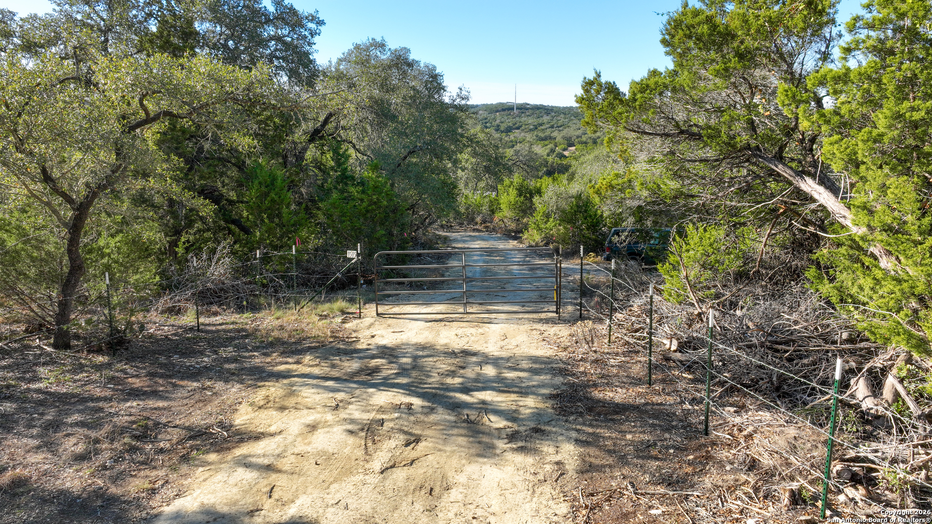 1515 Old Boerne Road Bulverde, TX 78163 - Photo 10 of 21 a backyard of a house with lots of green space