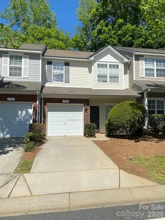 a front view of a house with yard