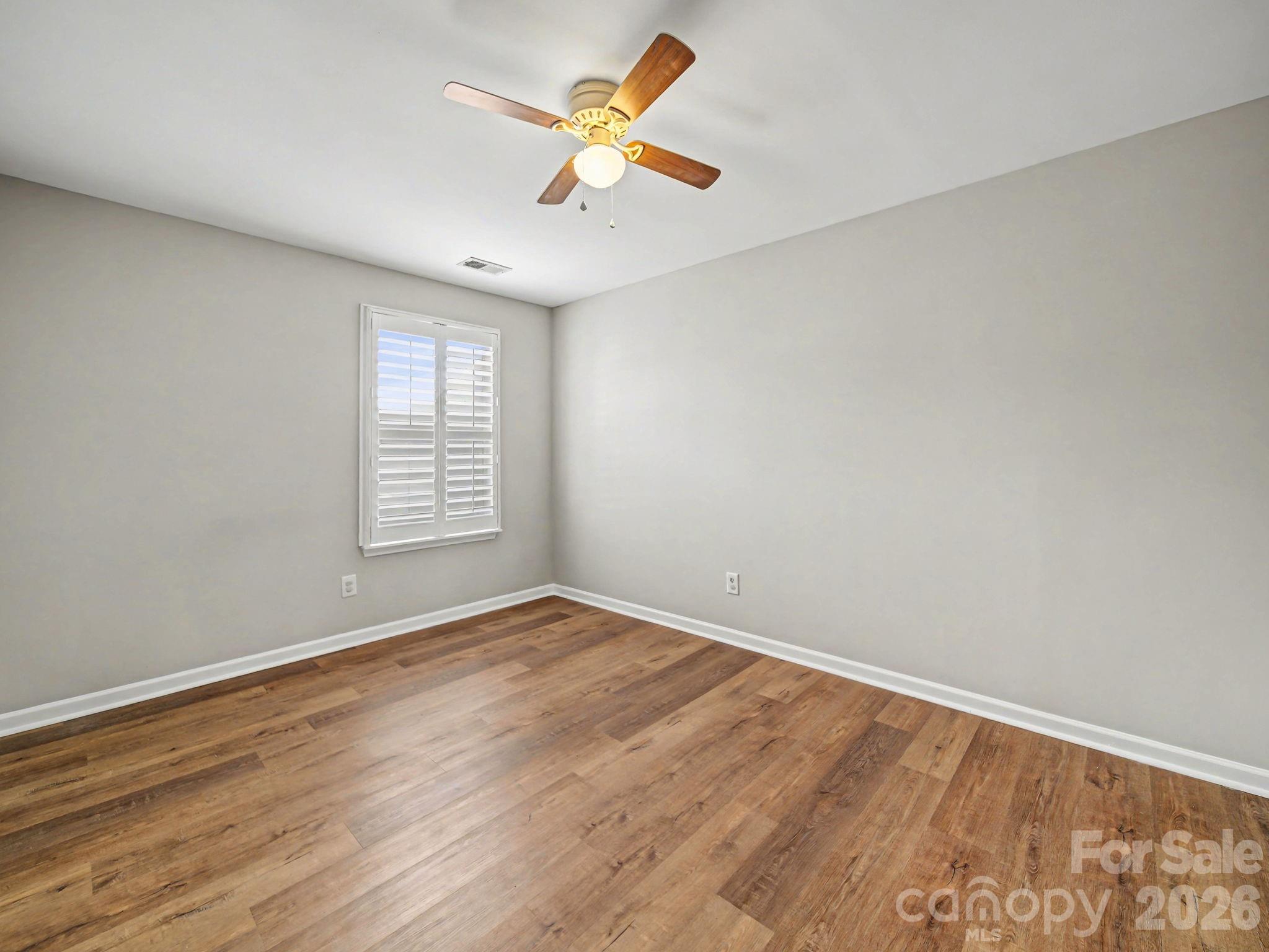 503 Delta Drive Fort Mill, SC 29715 - Photo 14 of 19 wooden floor in an empty room with a window
