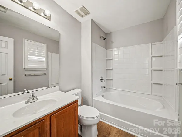 a bathroom with a sink a toilet and a bathtub