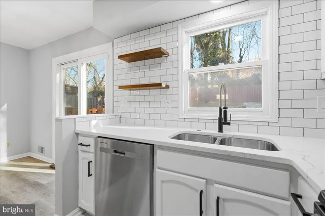 a kitchen with a sink and a window