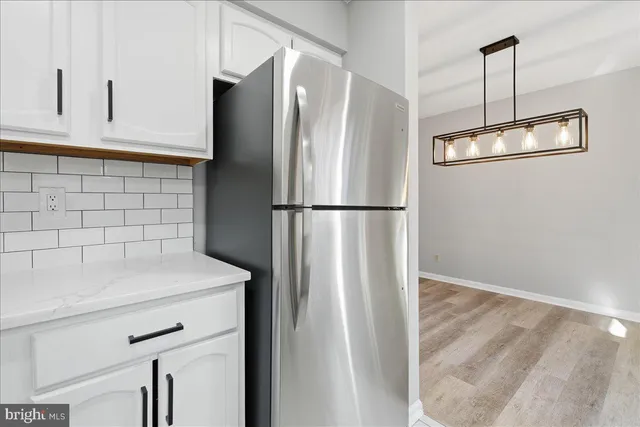 a kitchen with stainless steel appliances a refrigerator and a sink