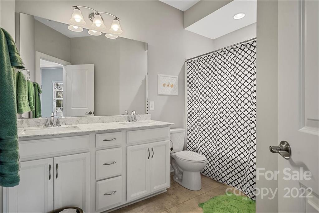 221 Helton Lane Fort Mill, SC 29708 - Photo 27 of 48 a bathroom with a double vanity sink mirror and toilet